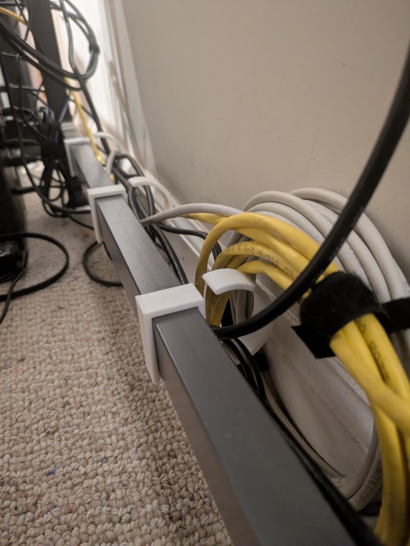 So many cables. I might redesign these to have a smaller profile, or maybe two different smaller cable holders. The way they are now, the cables aren’t well constrained. But it keeps them at least a little tidier than just laying all over the floor.
